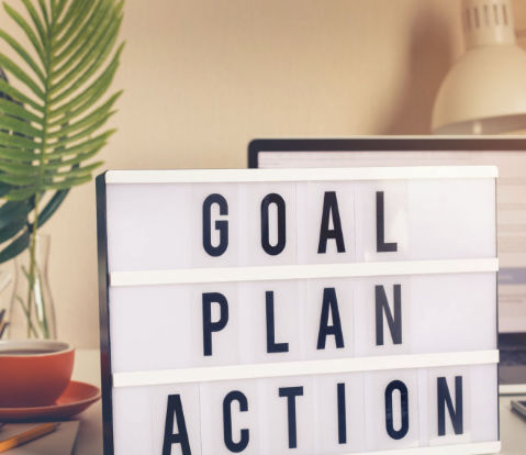 Lightbox reading Goal Plan Action on a desk—email marketing software strategy